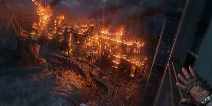 Des bâtiments brûlent dans Dying Light 2.