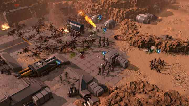 Des soldats tuent des arachnides dans Starship Troopers: Terran Command.