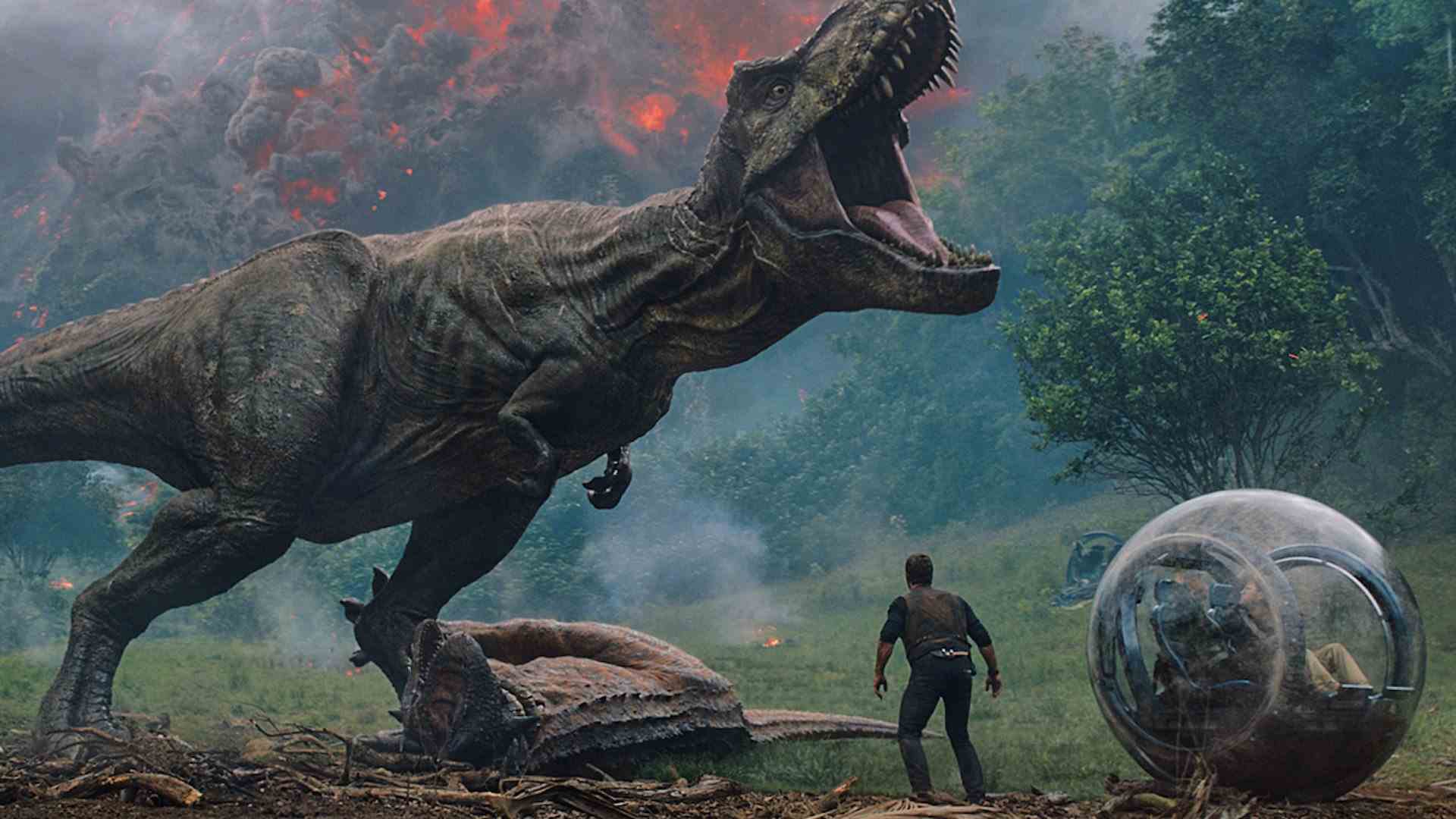 Un T-Rex rugit sur un Ankylosaurus mort alors qu'un homme se tient à proximité.