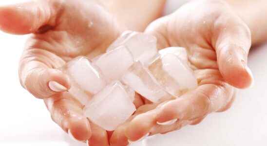 Why do ice cubes stick to my fingers
