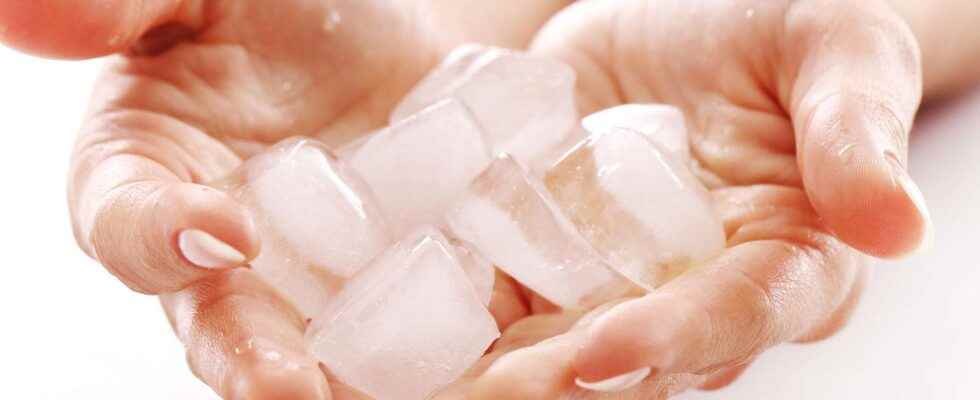 Why do ice cubes stick to my fingers