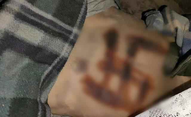 The swastika claim shuddered The raped tortured and cauterized corpse