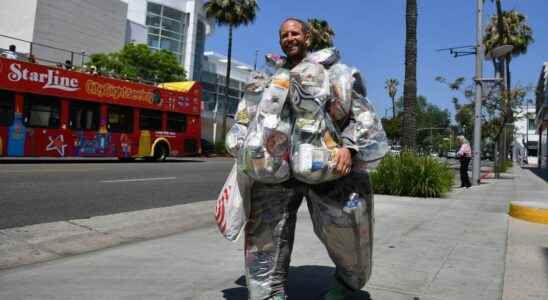 An American wears 30 days of waste on his back