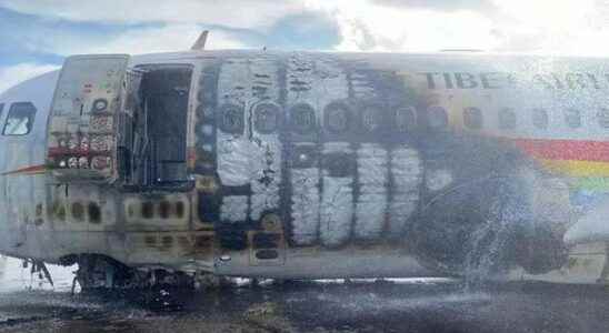 There were 122 people in it Plane caught fire during