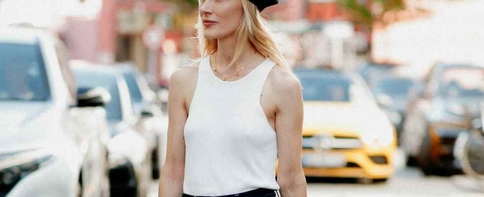 Here are 3 ways to twist a white tank top