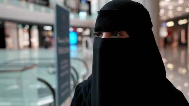 A woman wearing a hijab, who did not give her name, speaks to the BBC in a shopping mall in Jeddah