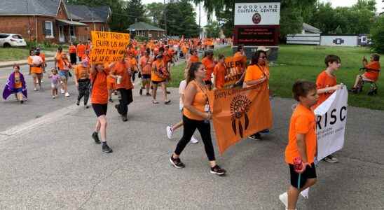 Hundreds march to honor residential school survivors