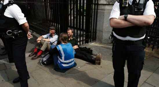 Activists glued to the British Parliament