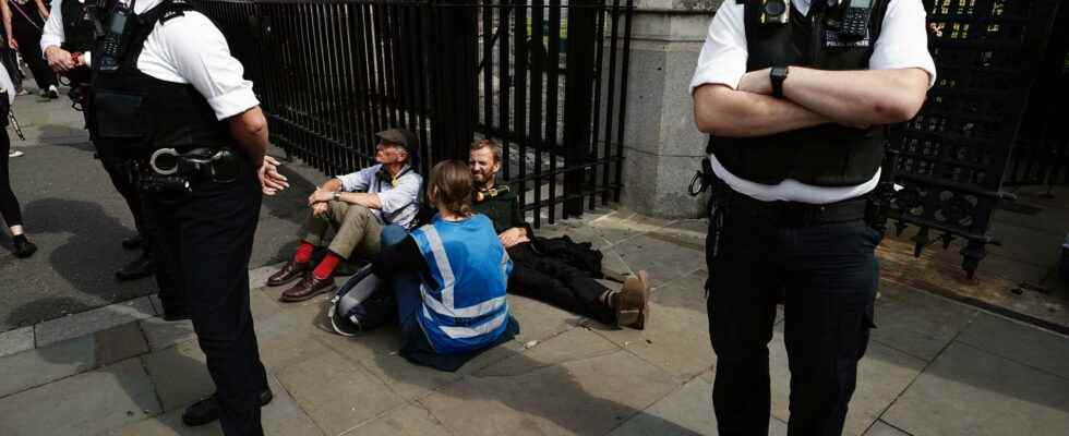 Activists glued to the British Parliament