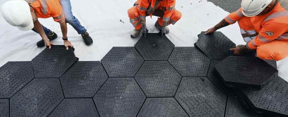 These recycled and recyclable plastic parking tiles irrigate the soil