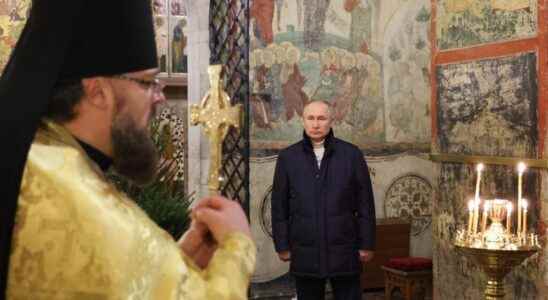 Vladimir Putin attends an Orthodox Christmas service alone in a